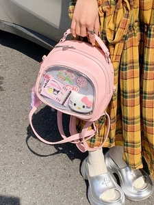 Pink faux leather ita bag with clear display window showing cute cartoon characters