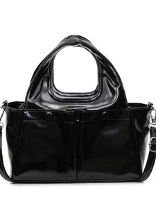 Large black glossy tote bag with front pockets and adjustable strap on white background