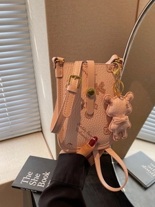 Pink pebbled leather crossbody phone bag with Keddy Bear University print and charm