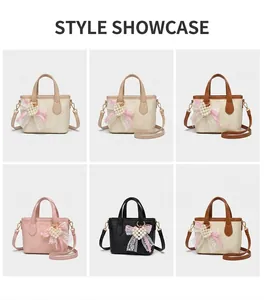 Detailed views of the butterfly bow mini bucket bag shown on a model for size and fit