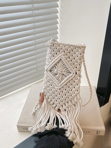 Bohemian ivory hand-woven straw crossbody bag with elegant fringe and diamond pattern