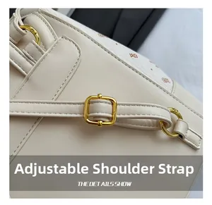 Macro detail of adjustable shoulder strap with golden buckles on a beige leather backpack
