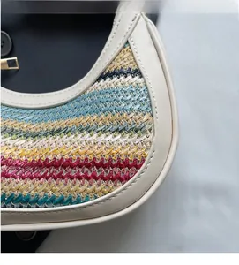 Detail of colorful rainbow woven straw texture with cream leather edges on summer bag