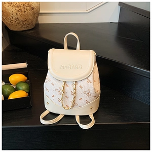 Detail of cream mini backpack with bear prints, 3D embroidery and gold chain decoration