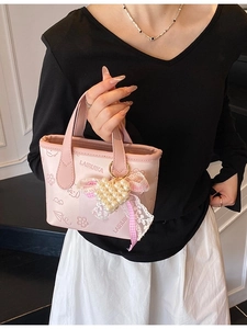 Pink butterfly bucket bag for women featuring a pearl heart pendant and chic bow accessory