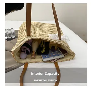 Detail view of straw tote bag interior showing large capacity for tablet and daily items