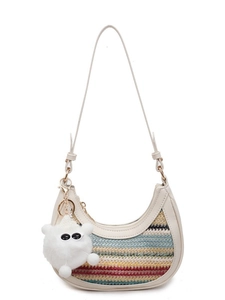 Chic cream straw crescent shoulder bag with colorful stripes and fuzzy eye charm
