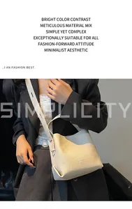 Close-up of cream litchi grain leather bucket bag with brand logo and shoulder strap