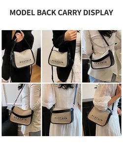 Detail showing beige knit fabric texture with black leather trim and printed lettering