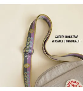 Close-up of multicolor woven wide shoulder strap with silver adjustable metal buckle
