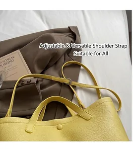 Detailed macro view of bright yellow pebble leather texture and adjustable shoulder strap