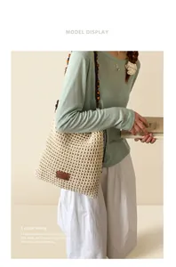 Close-up of beige hollow-out woven tote bag with vintage dark brown wooden bead straps