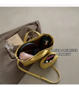 Detail of yellow bucket bag set with inner pouch showing large storage capacity