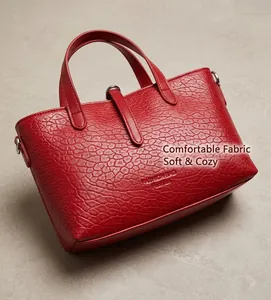 Close-up of red ostrich pattern textured leather and fashion bag embossed details