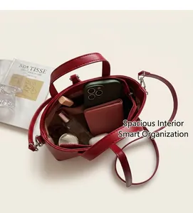Interior view of red PU leather bucket bag showing large capacity and zipper pocket