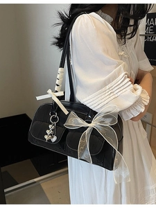 Chic black saddle bag with white organza bow and silver heart charms for women