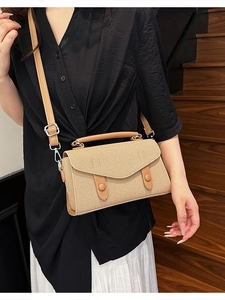 Chic beige woven crossbody bag with envelope flap and adjustable leather strap