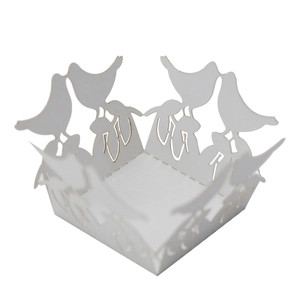 Detailed laser-cut white wedding candy box featuring intricate hollow bird patterns