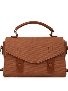 Brown woven canvas crossbody handbag with retro leather trim and adjustable shoulder strap