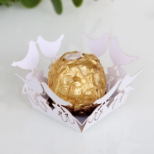 Laser-cut white paper chocolate wrapper with hollow bird design for wedding favors