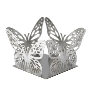 Macro shot of silver hollow butterfly pattern base for wedding cupcake and gift boxes