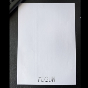 Minimalist white A4 card featuring precise laser-cut perforation and MIGUN branding