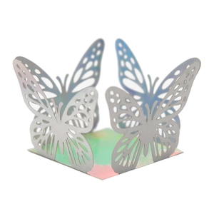 Macro shot of 3D hollow butterfly laser cut box in iridescent pearlescent white finish