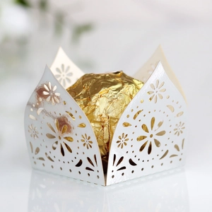 Detailed laser-cut pearl white candy holder with delicate floral pattern for weddings
