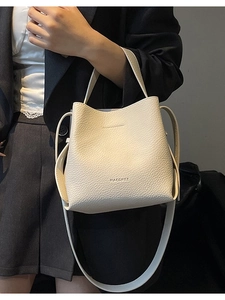 Chic cream lychee pattern bucket bag with MAGCHEE logo and crossbody strap