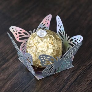 Detailed laser-cut butterfly iridescent candy tray for luxury wedding chocolate packaging