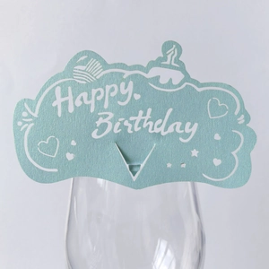 Detail of light blue Happy Birthday cup card with hollow pattern and cake motif