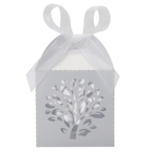 Detailed laser-cut tree design on white candy box with white organza ribbon bow