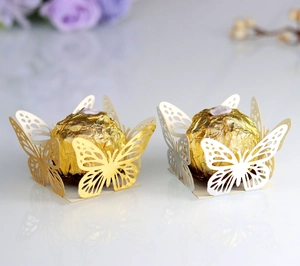 Detailed laser-cut butterfly lace design on gold and silver chocolate gift boxes