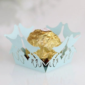 Laser-cut light blue bird design paper lace wrappers for chocolate and dessert favors