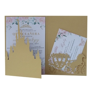 Detail of gold laser-cut castle invitation set with floral inserts and carriage pocket