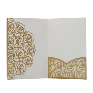 Intricate laser-cut gold glitter wedding invitation with elegant rose floral patterns