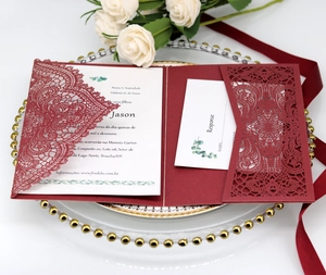 Elegant burgundy laser cut wedding invitation set with floral patterns and cards