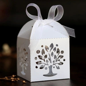 Detailed laser-cut tree of life gift box in white pearlescent paper with organza ribbon