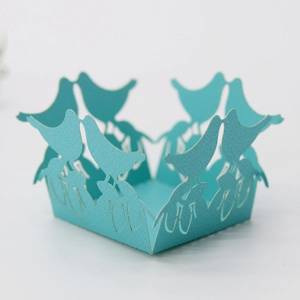 Detailed laser cut bird design on a bright cyan hollow wedding favor candy box