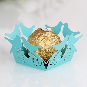 Detailed laser cut bird design candy wrapper in sky blue with hollow lace texture