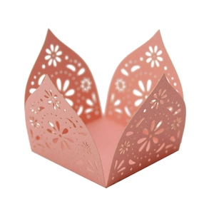 Detail showing pink laser-cut floral hollow pattern for cupcake wrappers