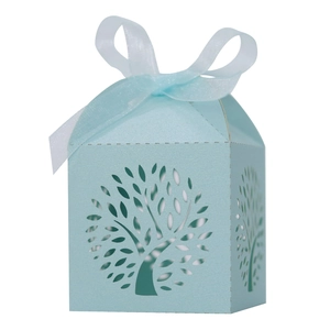 Macro detail of laser-cut Tree of Life candy box in Tiffany blue with organza ribbon