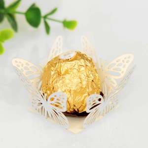 Macro shot of laser-cut butterfly hollow chocolate holder for wedding party decor
