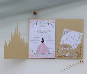 Macro detail of laser-cut gold castle invitation with elegant floral insert and reply card