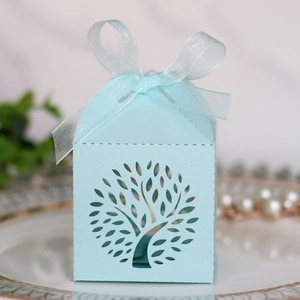 Detailed laser-cut tree of life candy box in light blue with elegant organza ribbon bow