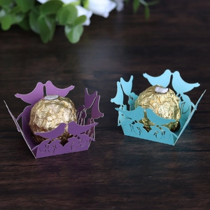 Detailed laser-cut candy boxes with bird design for wedding and party decorations