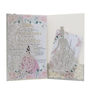 Detail of silver glitter laser-cut invitation featuring pink roses and RSVP card