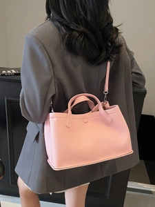 Chic pink lychee-textured leather tote bag with crossbody strap and magnetic clasp