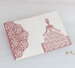 Detail of rose gold glitter wedding invitation with laser-cut floral patterns and female silhouette