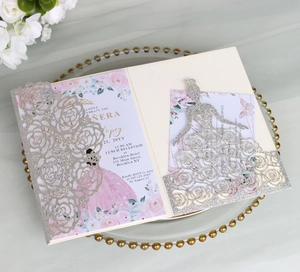 Macro shot of silver glitter laser-cut rose invitation with floral girl illustration